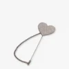Broche metálico con pedrería